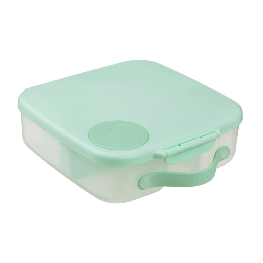 Green lunchbox with a lid on a white background
