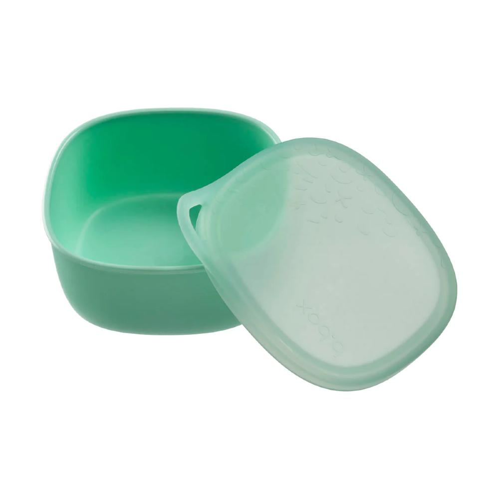 Green plastic container with a lid on a white background