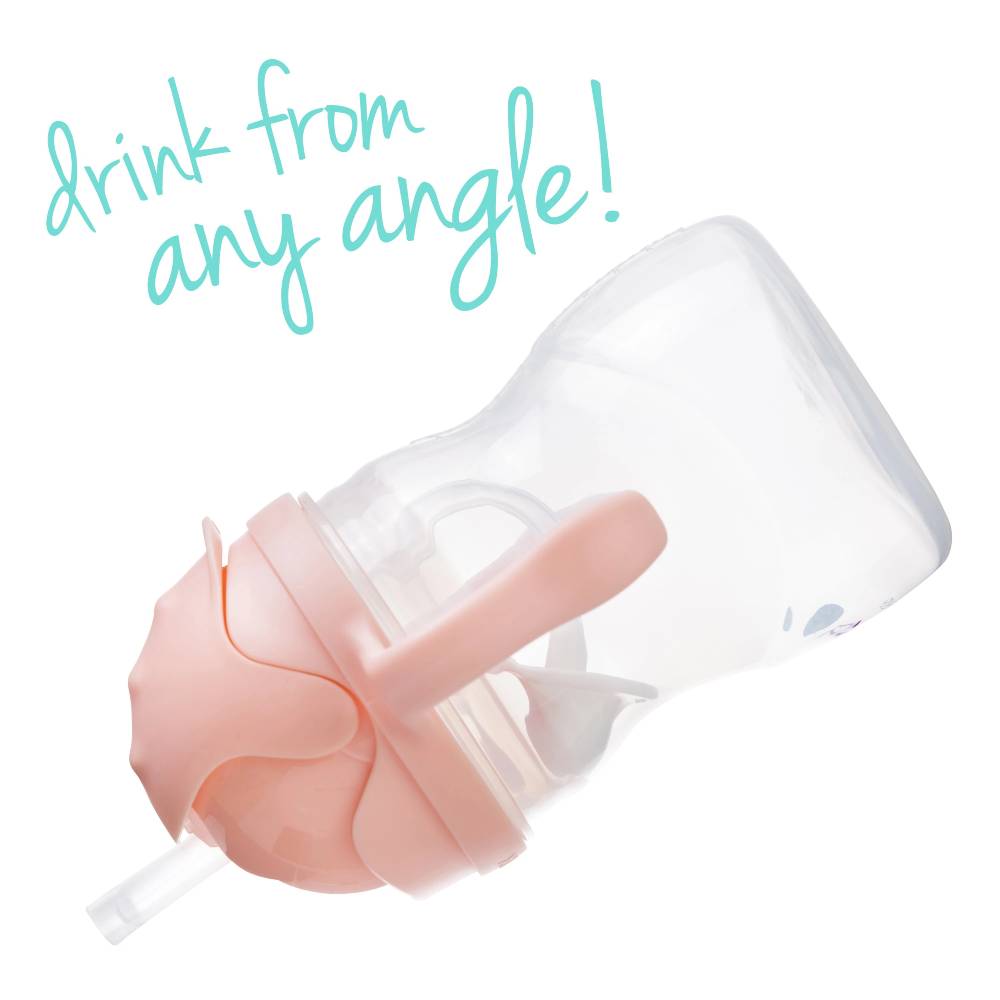 Sippy cup with pink spout and straw on a white background