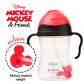 Disney Mickey Mouse and Friends sippy cup with red weight and black handle on a white background