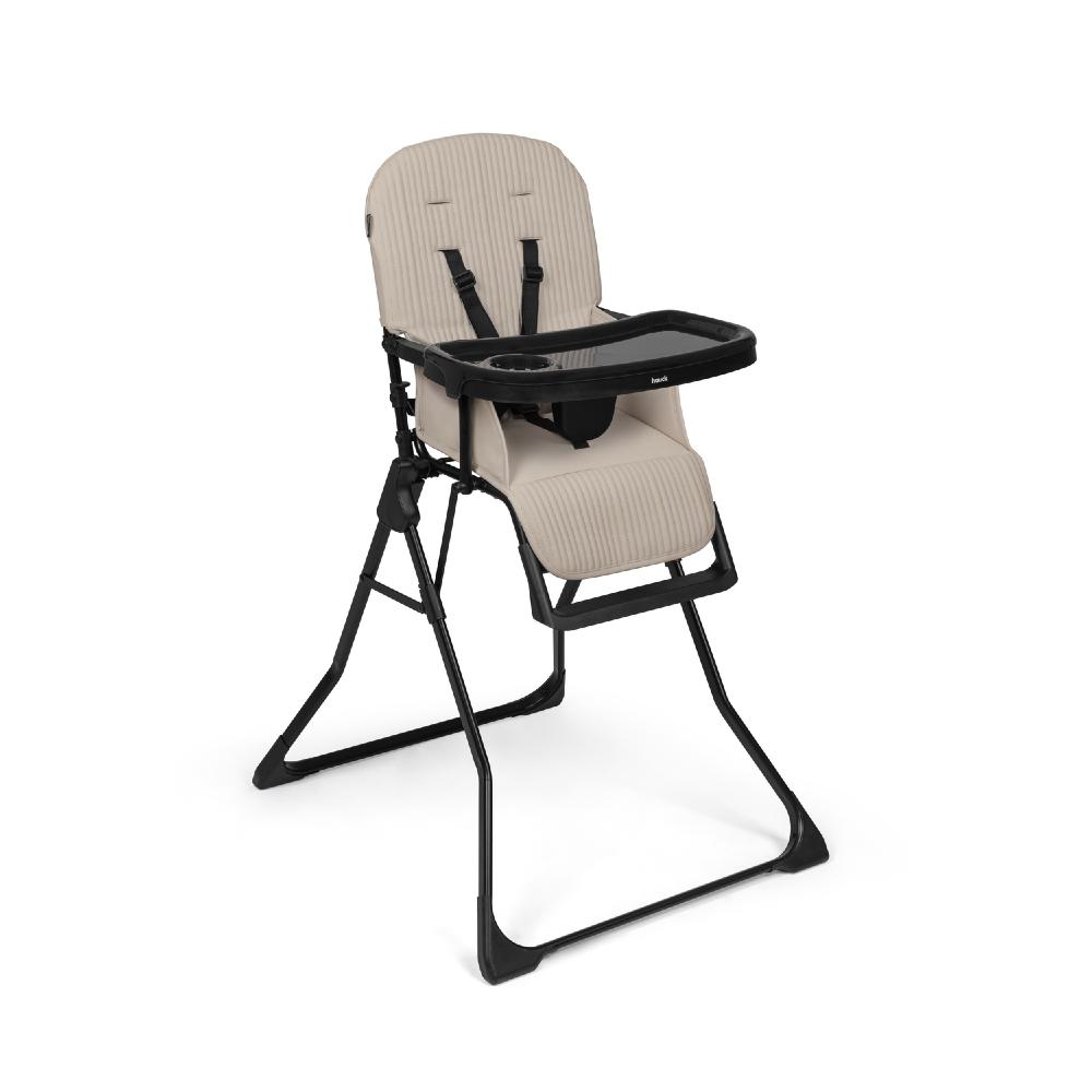 Beige high chair with black tray on a white background