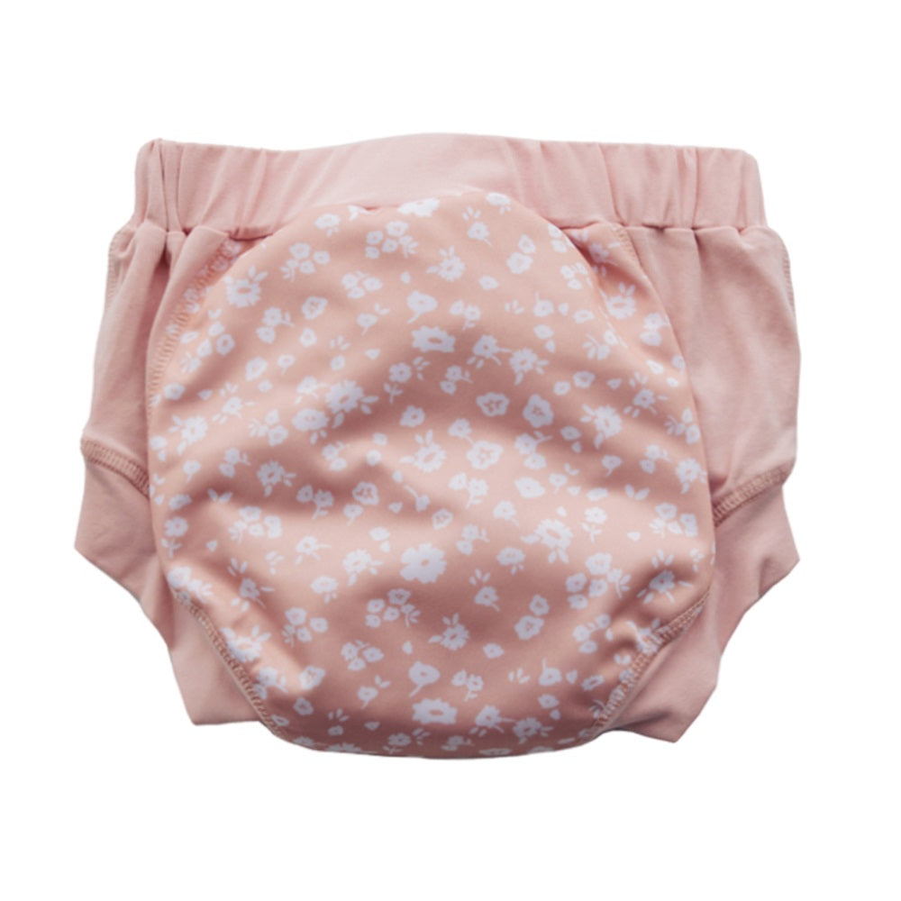 Pink training pants with white daisy  pattern on a white background