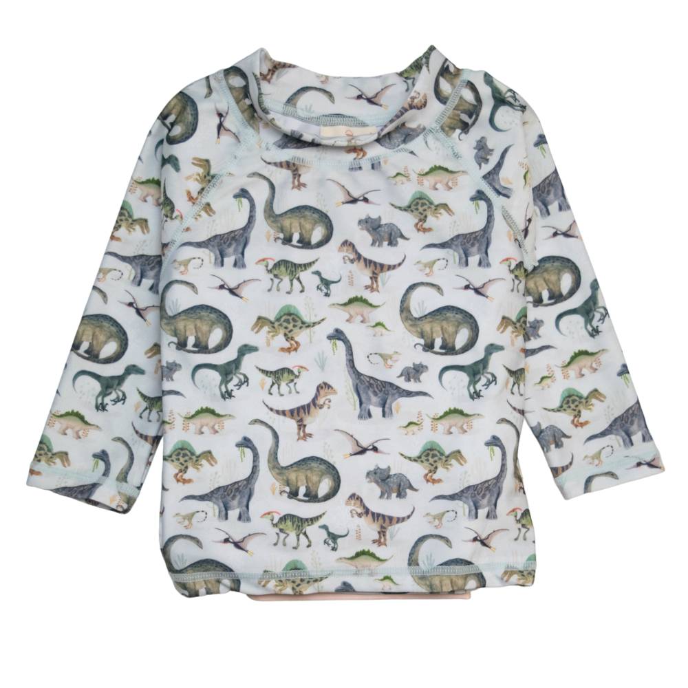 Children's long-sleeve rash shirt with dinosaur pattern on a white background