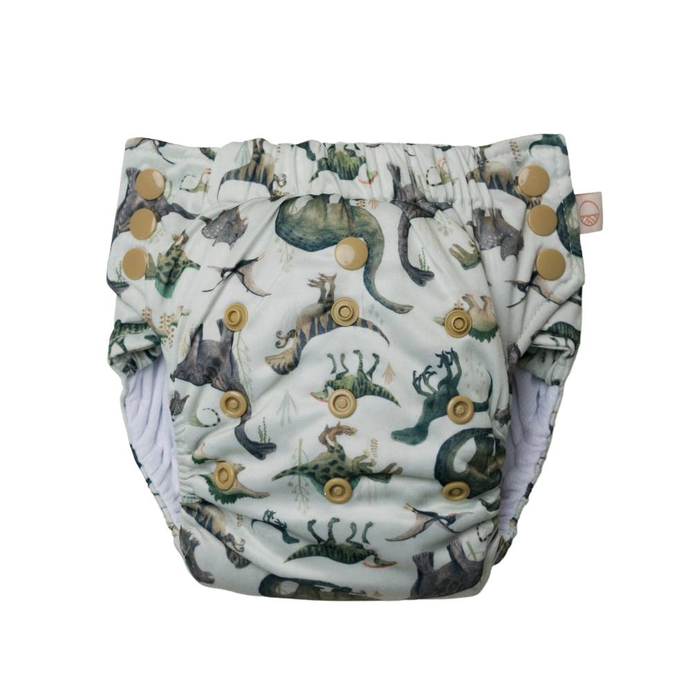 Reusable Nappy pant in dinosaur print with snaps on a white background