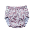 Reusable toddler pull-up style nappy with a floral pattern on a white background