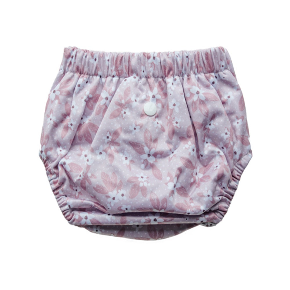 Reusable toddler pull-up style nappy with a floral pattern on a white background