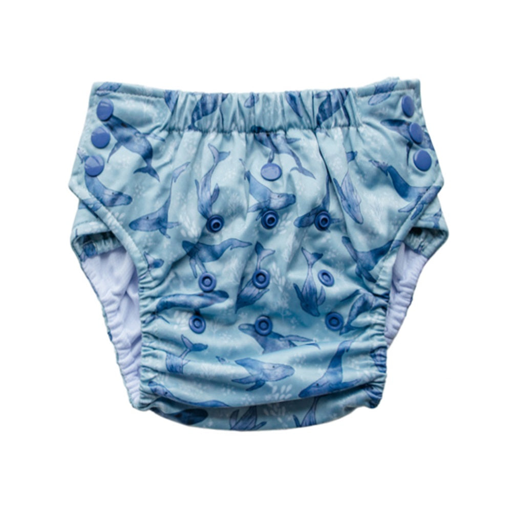 Blue whale patterned nestling straight up nappy on a white background