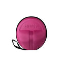 A round, bright pink textured carrying case with a black zipper border and a black wrist strap, shown on a plain white background.