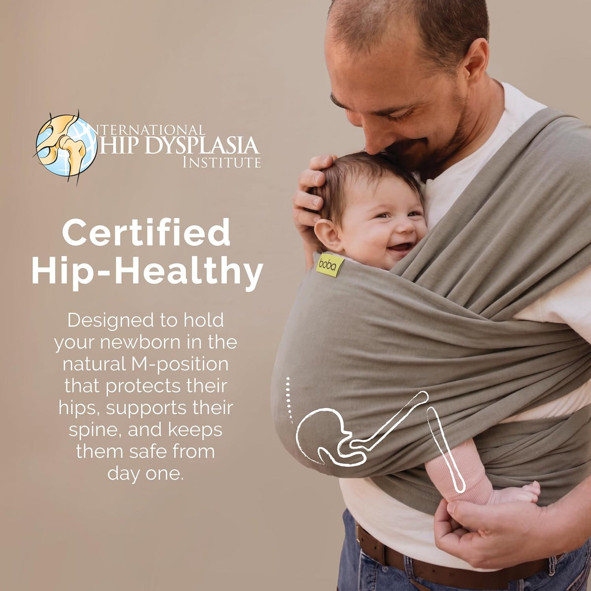 A man wearing a baby carrier with a smiling infant inside, shown against a plain beige background with promotional text for the International Hip Dysplasia Institute and product callouts.