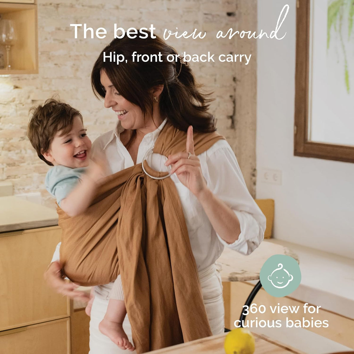 Woman holding a child in a brown baby wrap with text about baby carriages.