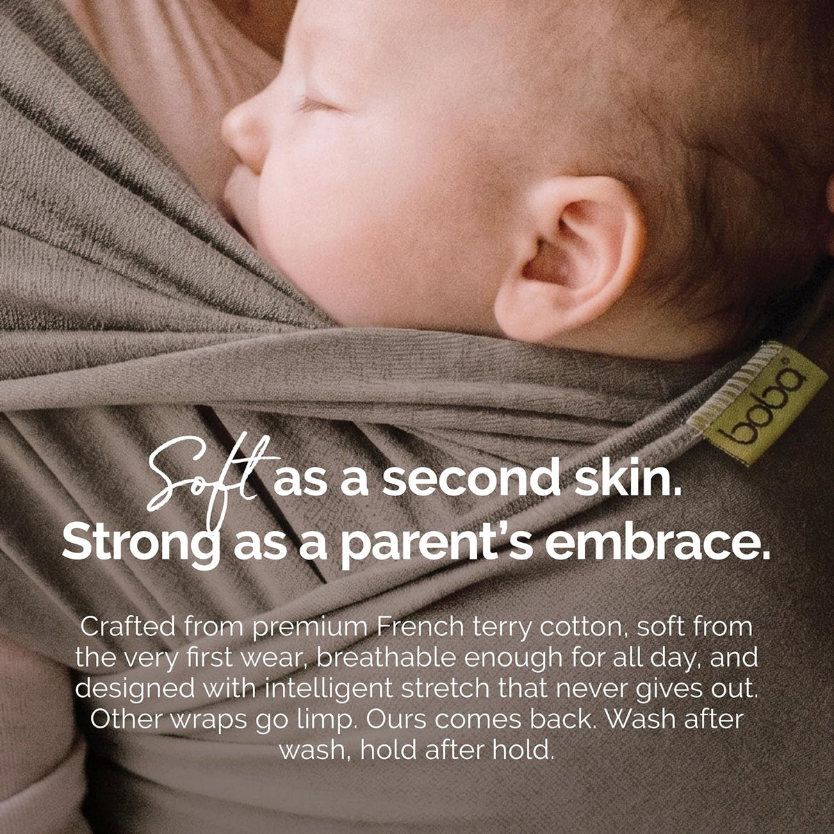 A close-up of a baby wrapped in a soft brown French terry cotton wrap, with text overlay describing its comfort and strength, and a small yellow brand tag reading 'boba' visible on the side.