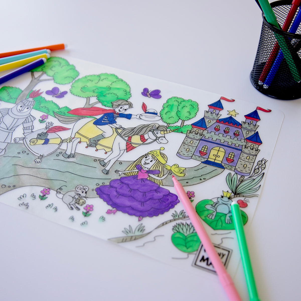 Reusable Colouring Mat - Princess colloured in with felts on a white table 