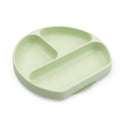 A green bumkins silicone plate with three sections on a white background 