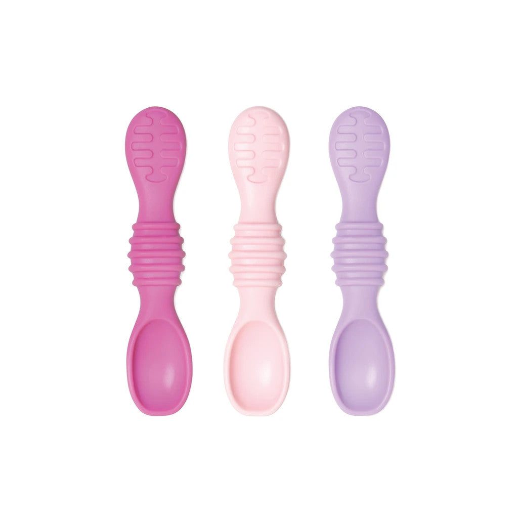3 silicone spoons in pink and purple on a white background
