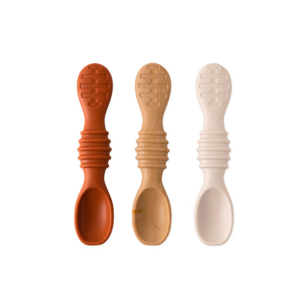 3 silicone spoons in browns on a white background
