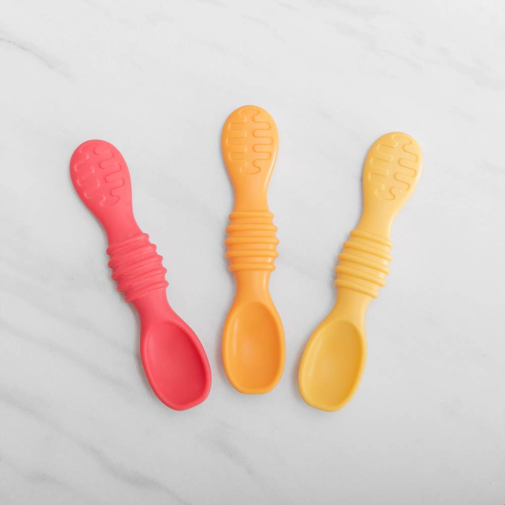 3 silicone spoons in red and yellow on a white background