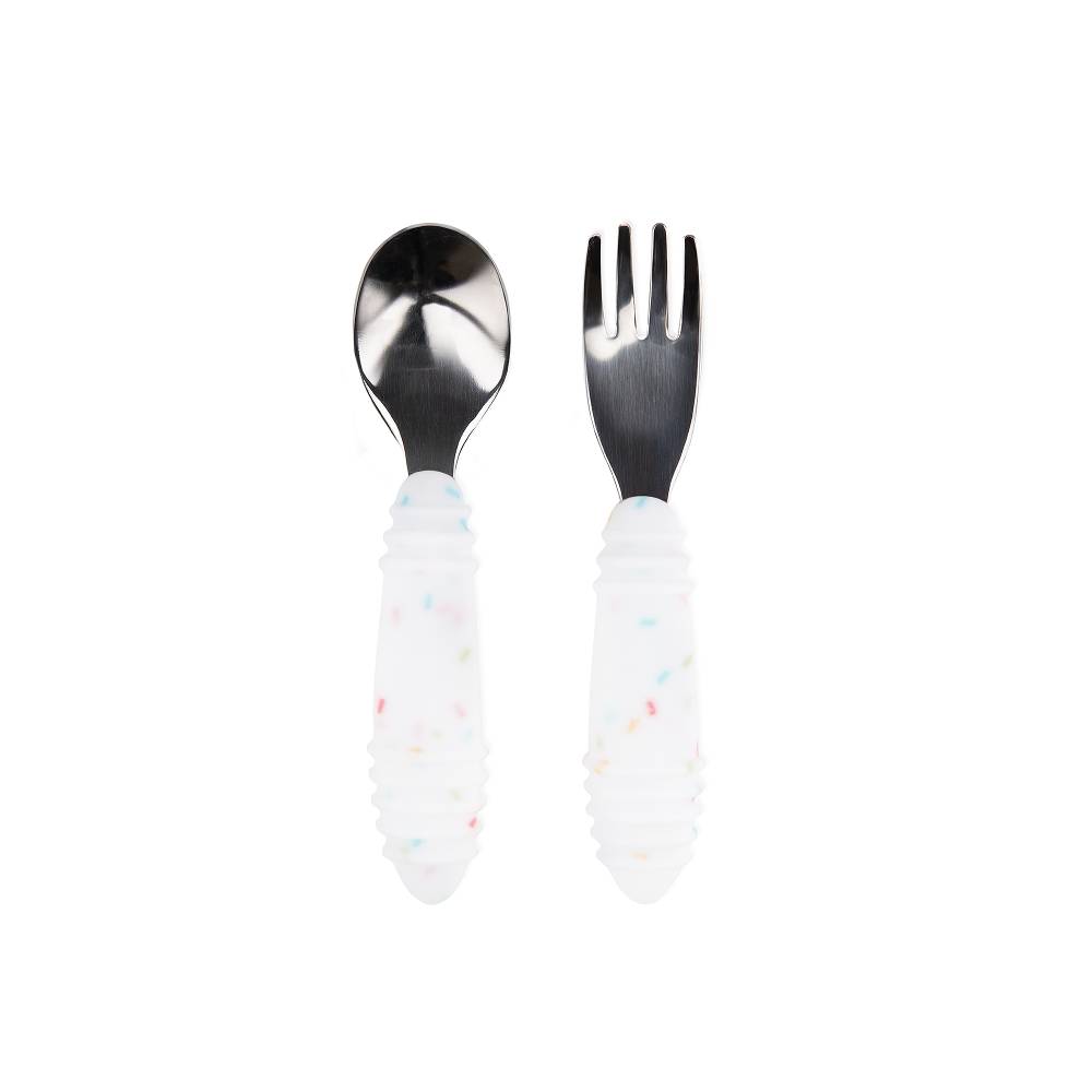 Stainless steel spoon and fork with white spotted silicone handles on a white background