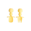 A yellow set of silicone baby cutlery chewtensils including one spoon and one fork with bumkins logo on the handle