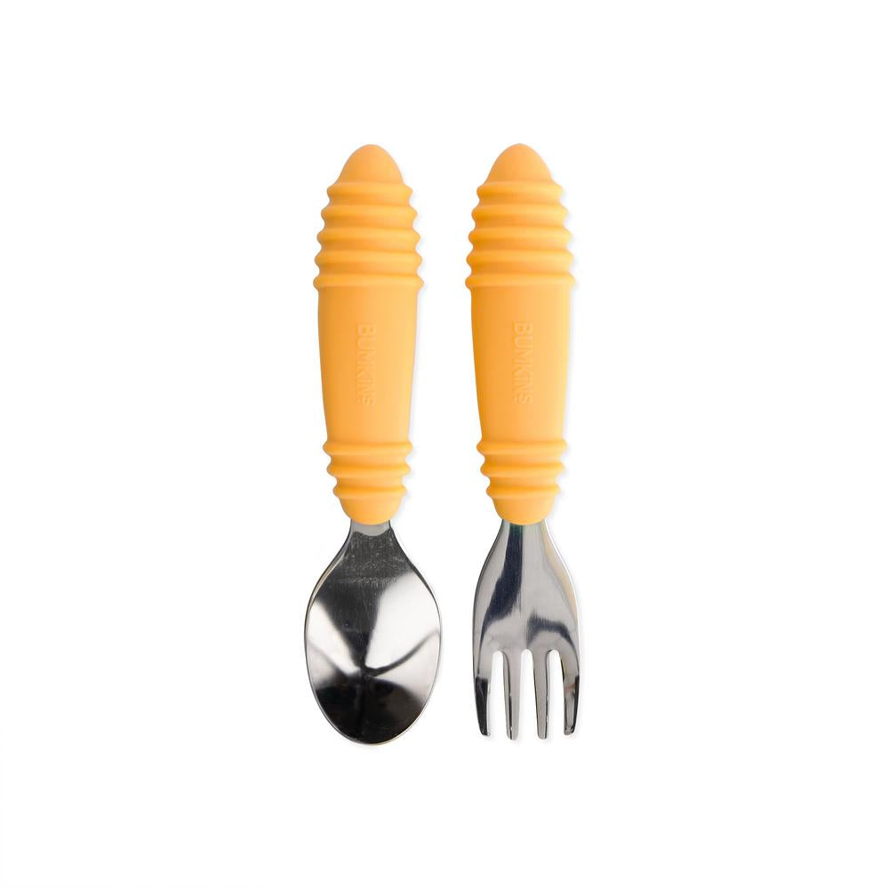 Stainless steel spoon and fork with tangerine silicone handles on a white background