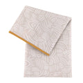 A beige with white patterned bumkins splat mat with mustard piping on a white background