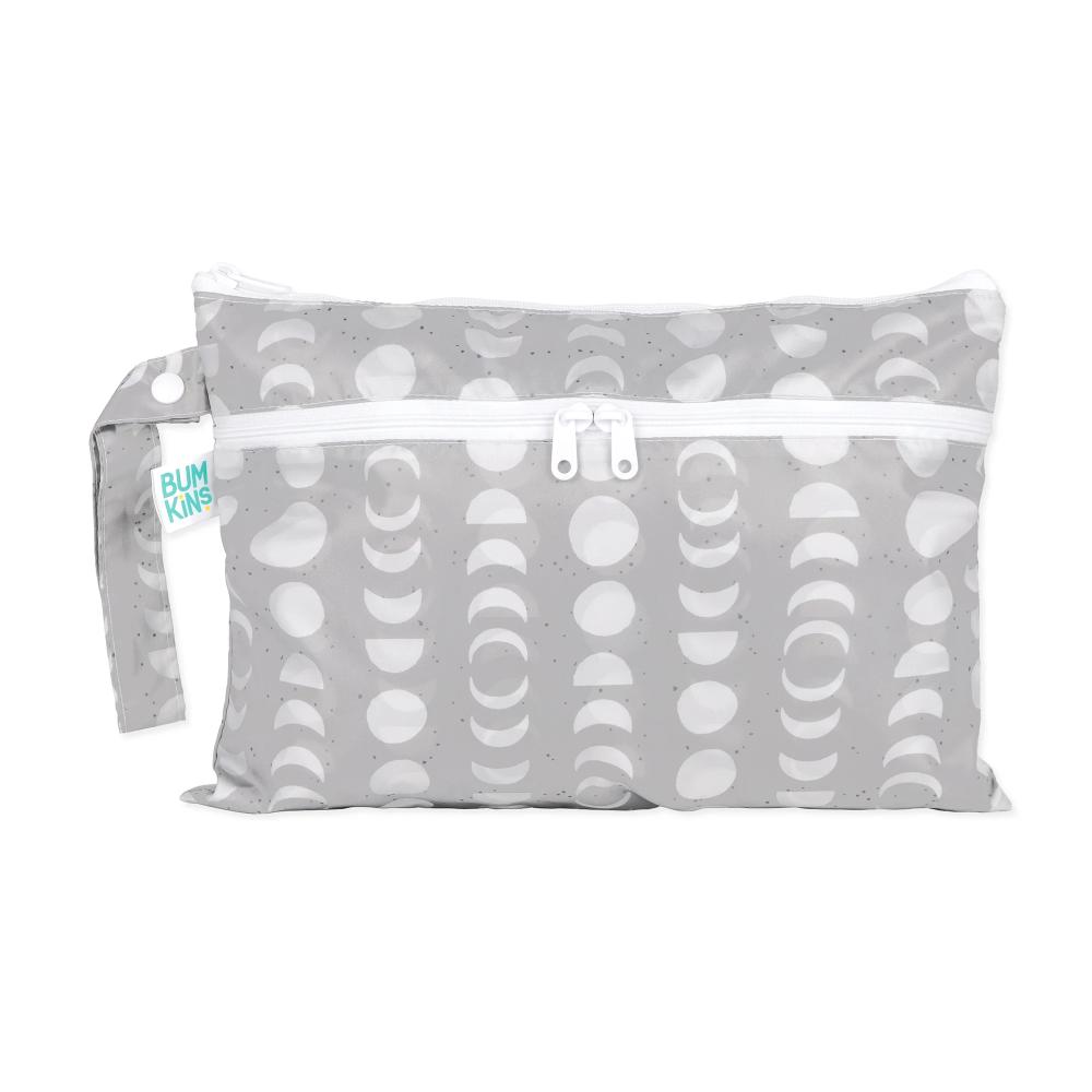 Wet and dry clutch with Grey and white lunar moon phase pattern and visible Bumkins brand tag on a white background