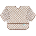 A long sleeve bib with elasticated wrists and front pocket in sand check pattern and bumkins tag