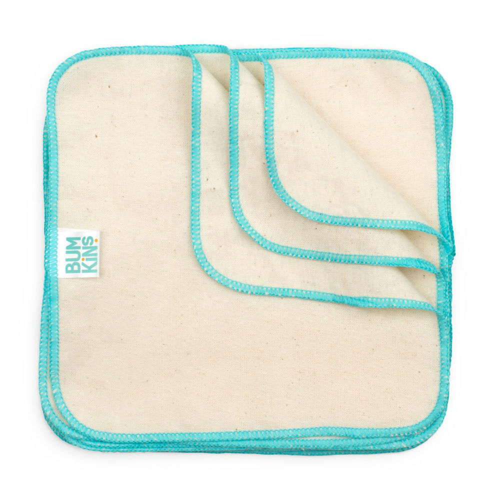 Three reusable cloth wipes with a natural beige cotton body and bright turquoise blue stitched borders. A small white tag on the left pad reads 'BUMKINS'.