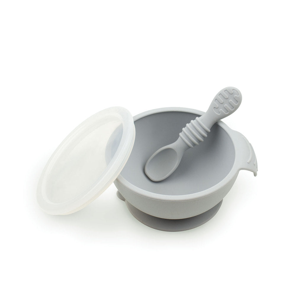 Grey Silicone Feeding Bowl with lid and silicone spoon on a white background