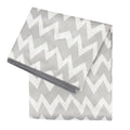 A grey and white splat mat with chevron pattern on a white background