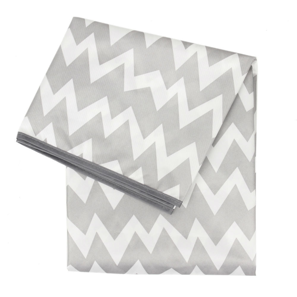 A grey and white splat mat with chevron pattern on a white background