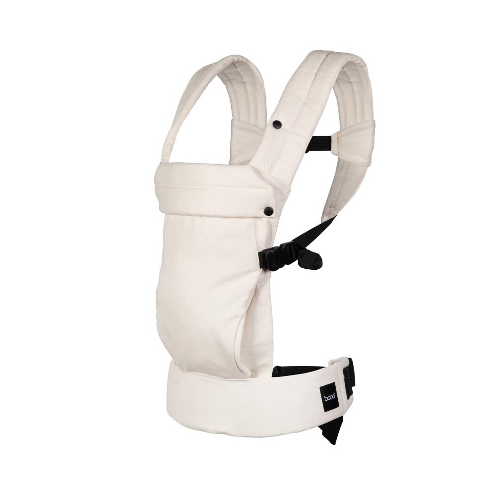 Baby carrier with beige fabric and black straps on a white background