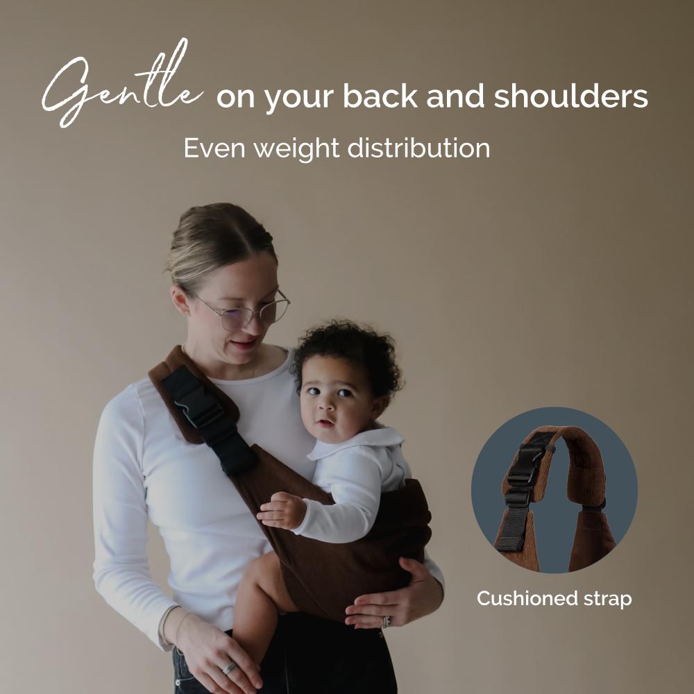 Woman holding a child in a brown baby side sling carrier with text about even weight distribution and a close-up of a cushioned strap.