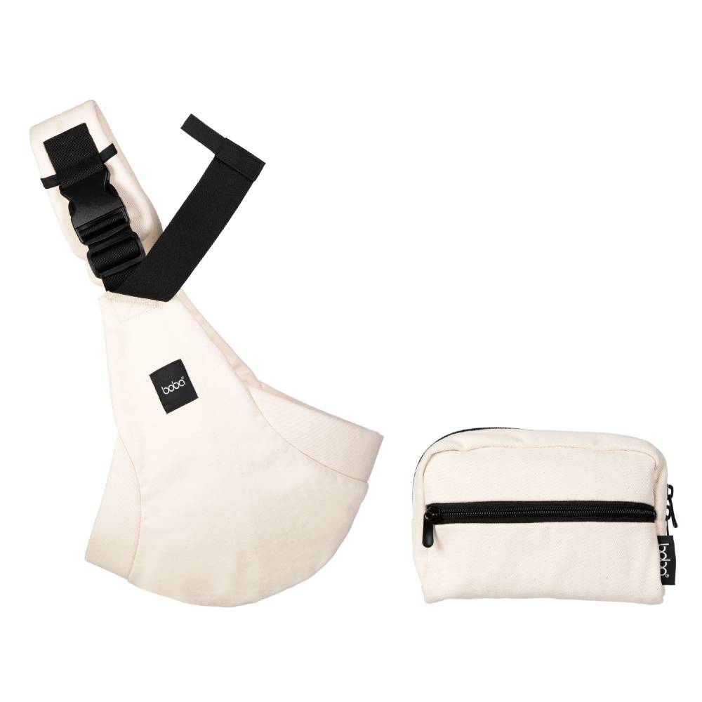 Oat cream coloured baby hip sling carrier with black straps and a matching pouch on a white background