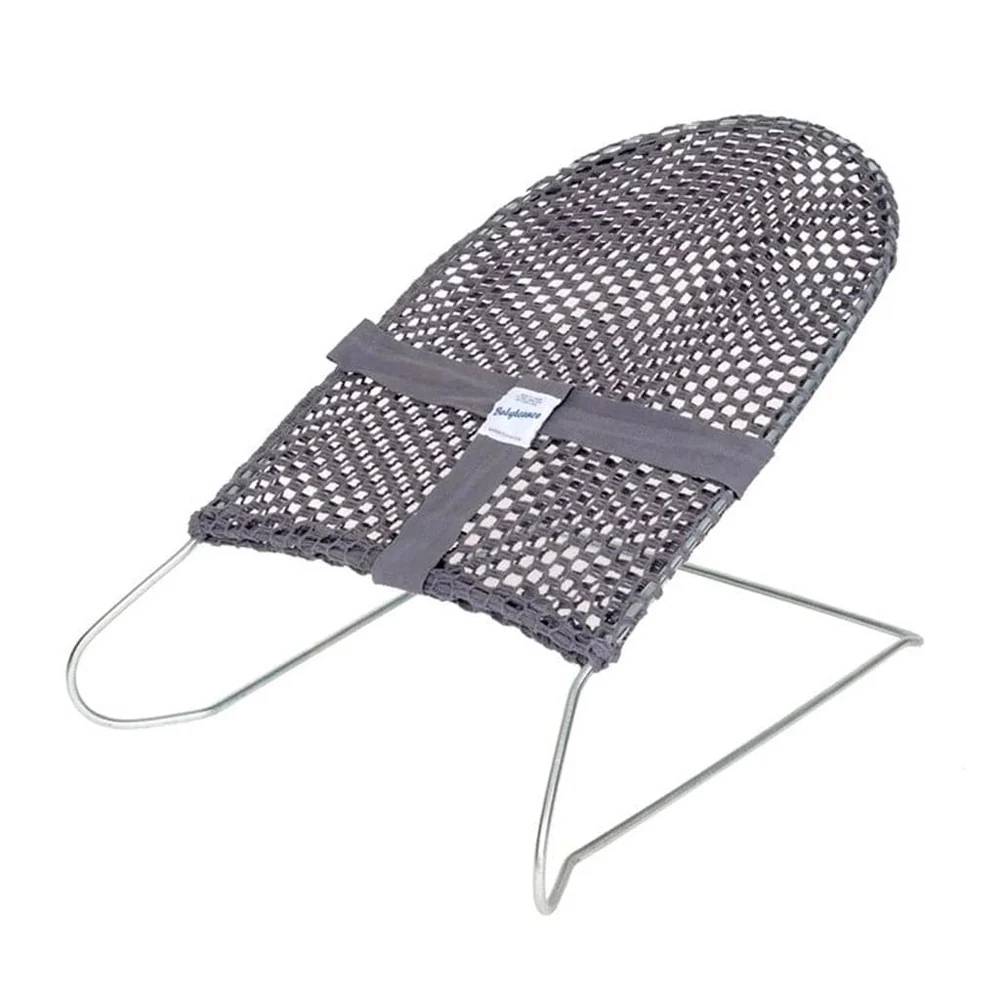 Grey coloured baby bouncer on white background.