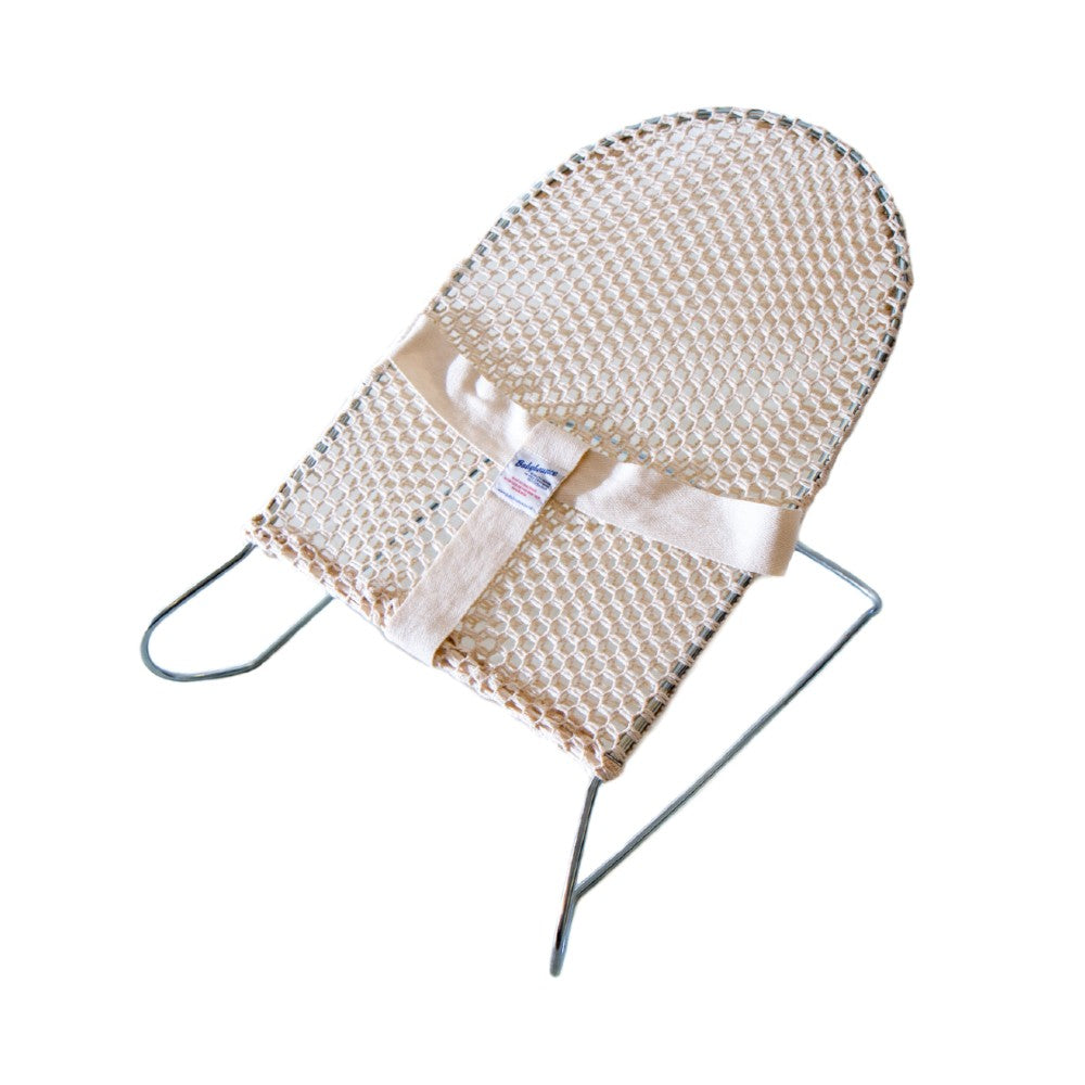 Natural coloured baby bouncer on w hit background.