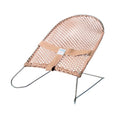 Sand coloured baby bouncer on white background.