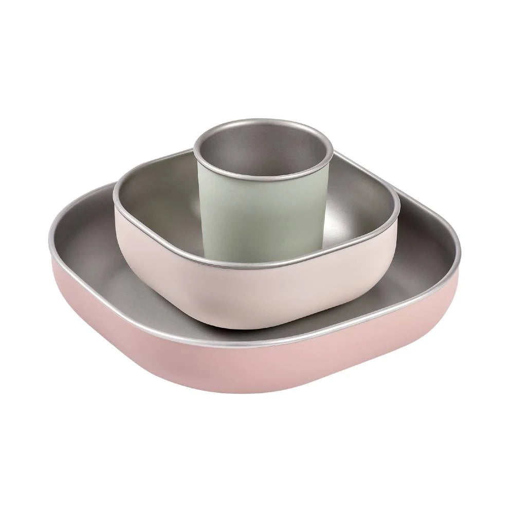 Stainless steel and silicone flatware set in a pink/beige colour against a white background
