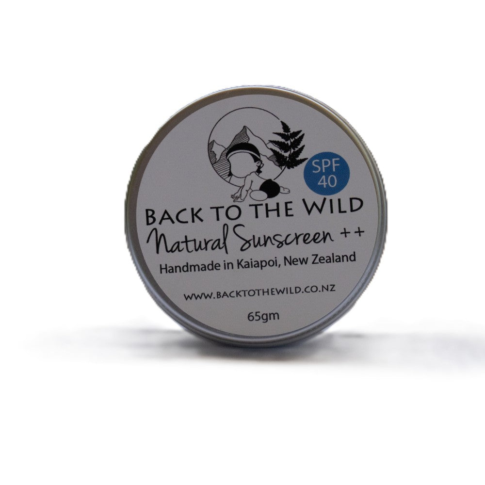 A round metal tin of Back to the Wild Natural Sunscreen ++ with SPF 40, shown on a clean white background with a soft shadow.