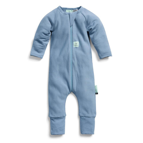 Blue baby onesie with a zipper on a white background