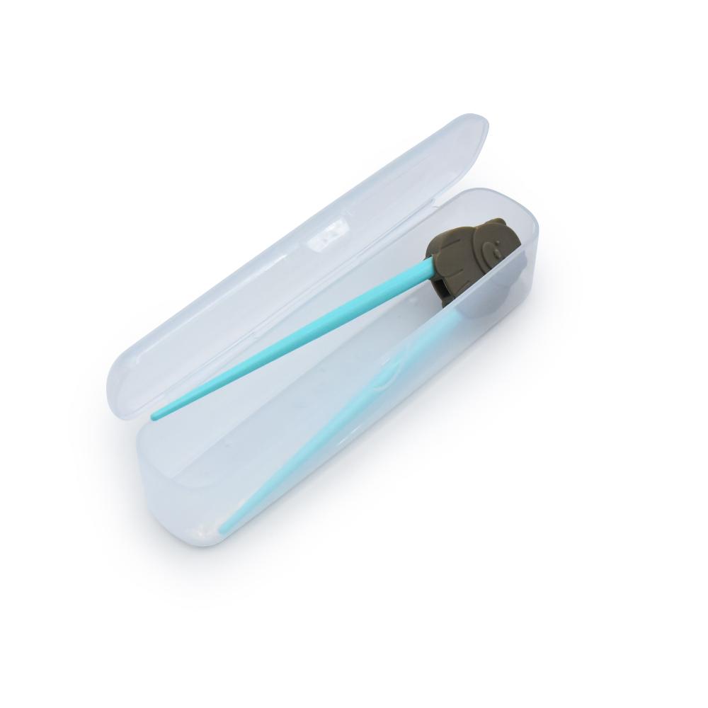 Clear plastic case with a blue chopstick trainers inside on a white background