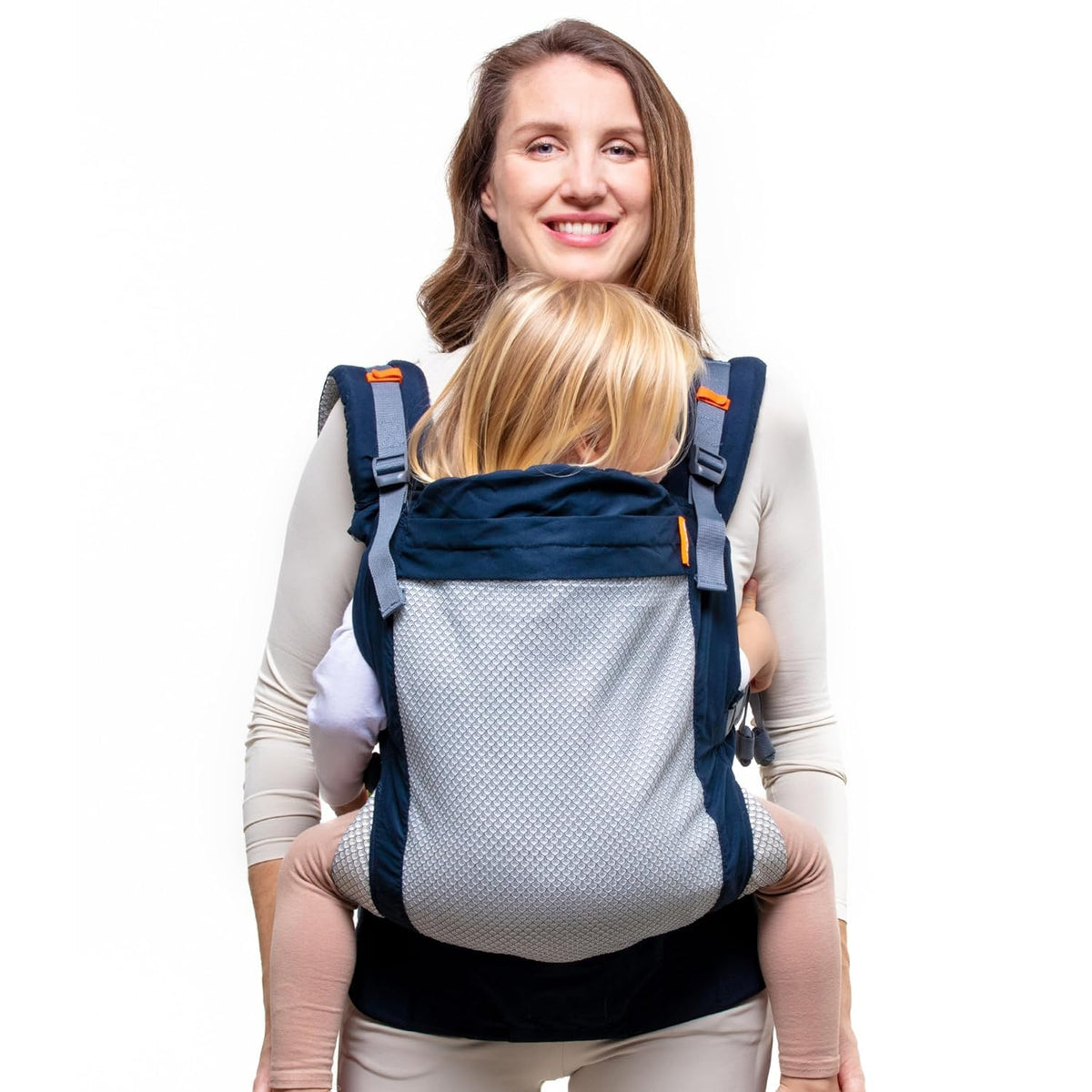 Woman carrying a child in a blue baby carrier on a white background