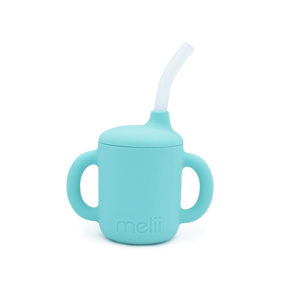 Turquoise Melii silicone sippy cup with a straw on a white background