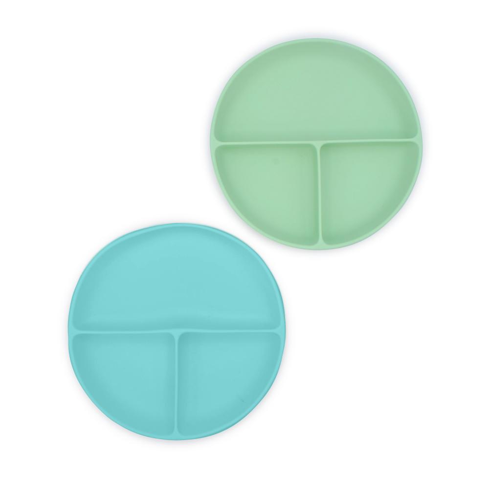 Two round divided silicone plates, one green and one blue, on a white background.