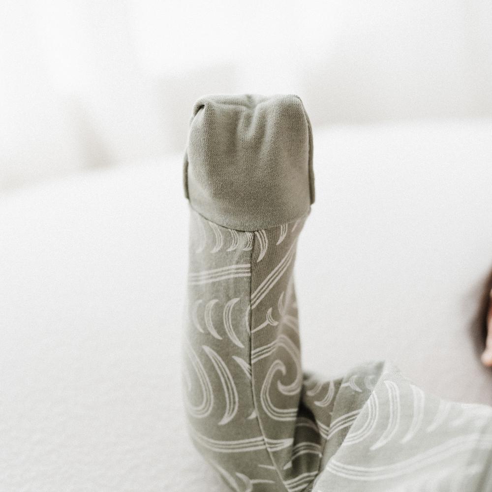 Light gray patterned pants on a white background