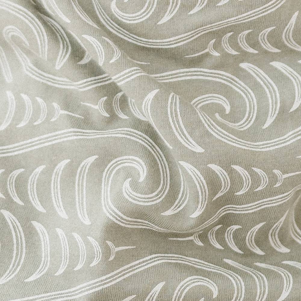 Fabric with white abstract pattern on a beige background