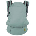 A sage green Boba X baby carrier shown from the back, featuring dark gray adjustable shoulder straps and a small yellow brand label on the lower right.