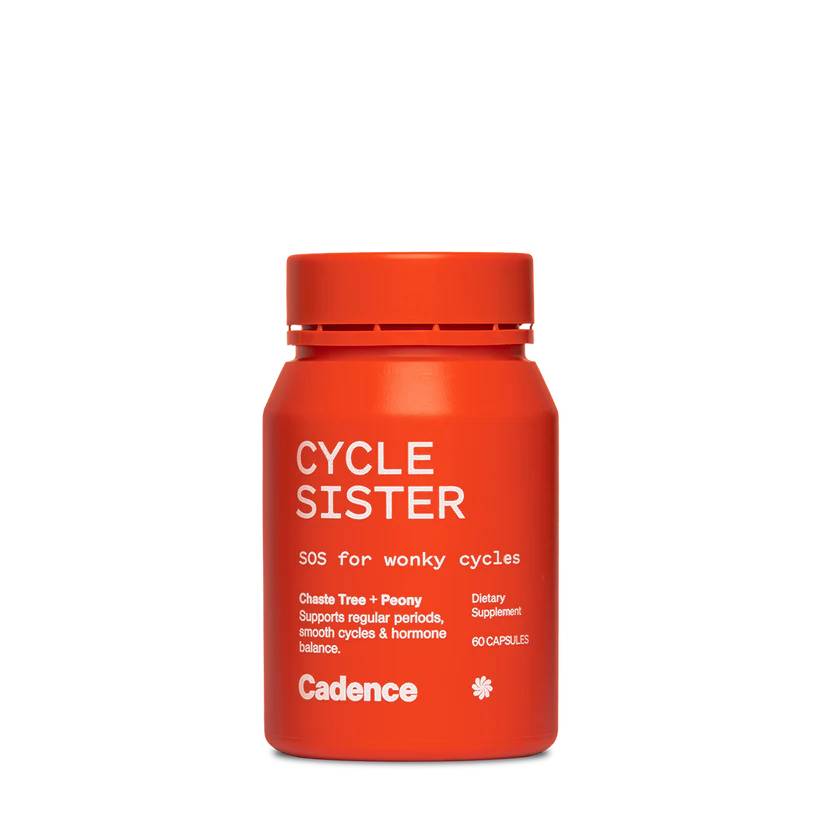A bright orange-red supplement bottle labeled 'Cycle Sister' by Cadence, photographed on a clean white background.
