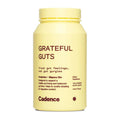 A pale yellow bottle of Cadence Grateful Guts dietary supplement with dark red text, shown on a plain white background.