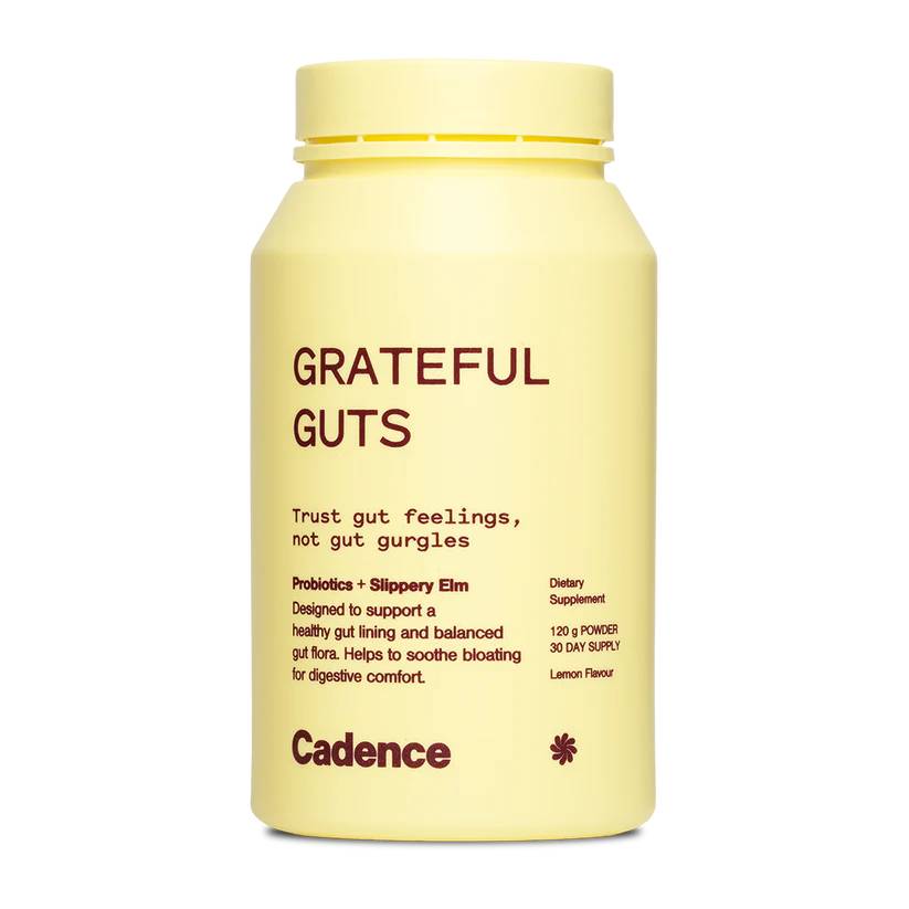 A pale yellow bottle of Cadence Grateful Guts dietary supplement with dark red text, shown on a plain white background.