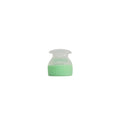 Small green and clear container on a white background